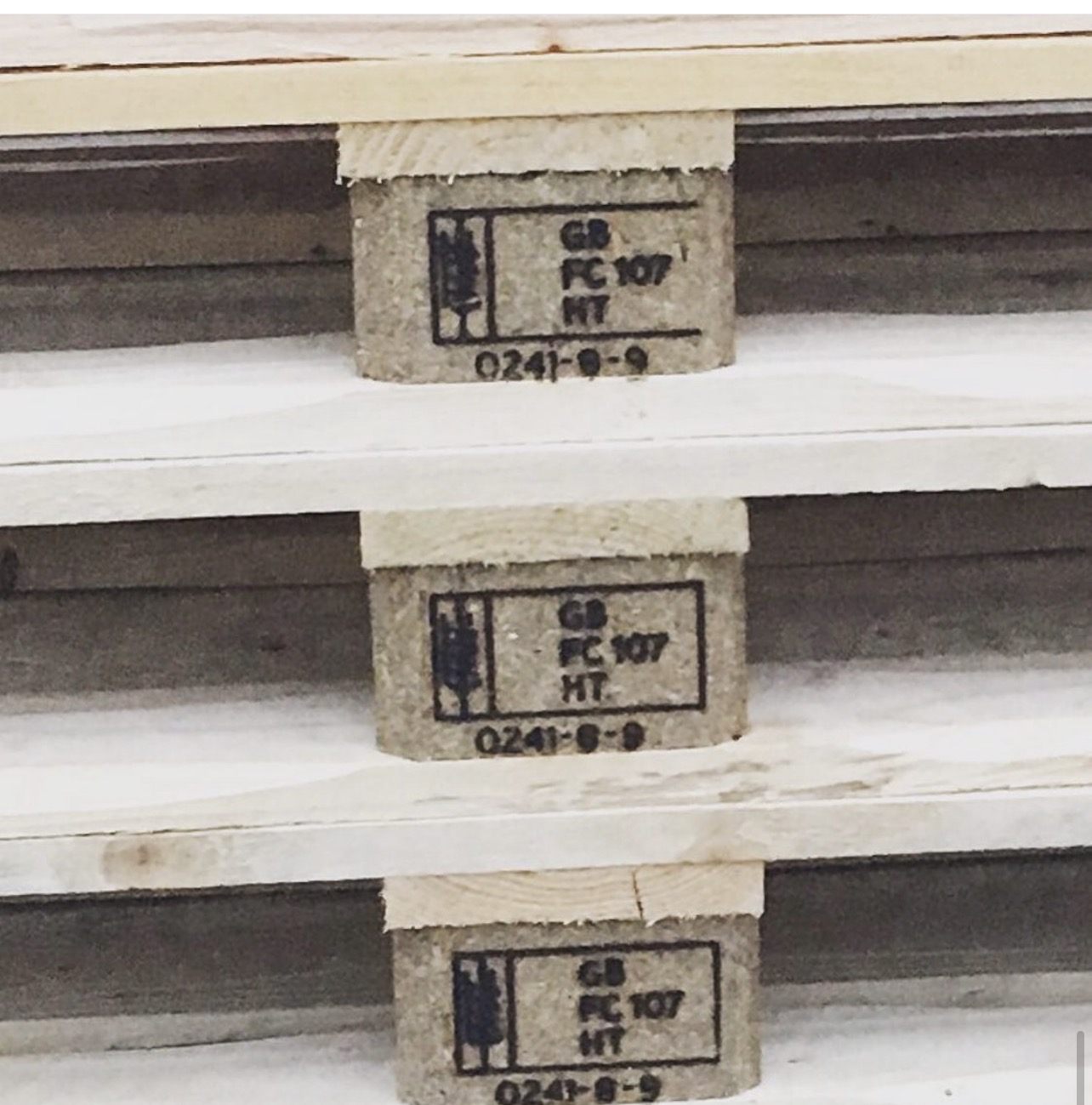 Treatment marks on three stacked pallet blocks